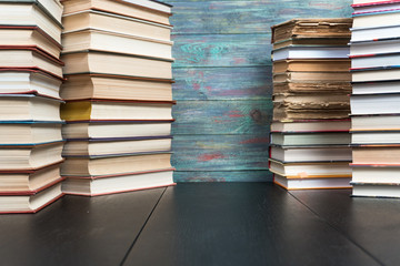 Stack books on wooden background. Back to school with copy space.