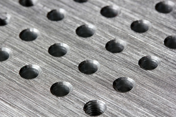 Silver metal background with round hole