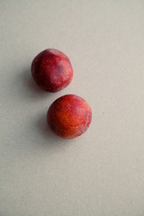 Ripe red oranges on gray background