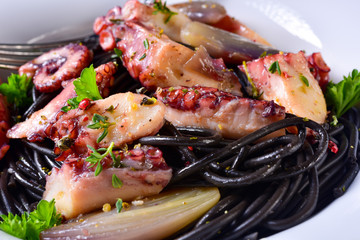 octopus with black spaghetti and garlic sauce