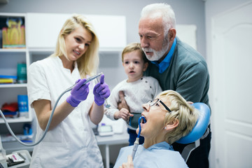 Obraz premium Senior woman having dental treatment at dentist's office. 