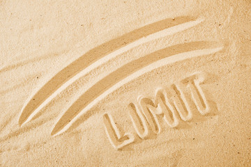 limit concept, line and word on sand