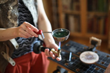 Home workshop girl master on gas burner boil water