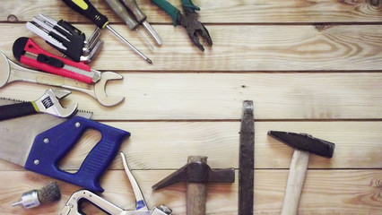 Bench tools on a wooden background.