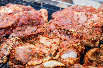 BBQ Roasted Pork Meat With herb spice On The Hot Charcoal Grill With Smoke.