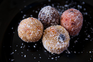 sweets without sugar, with grated dried fruits and nuts, sprinkled with coconut shavings, proper nutrition