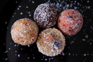 sweets without sugar, with grated dried fruits and nuts, sprinkled with coconut shavings, proper nutrition