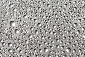 Good background made of a closeup of water droplets on the shiny surface.