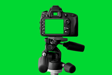 Fototapeta premium The Dslr camera with green screen on the tripod isolated on green background. The chromakey. Green screen.