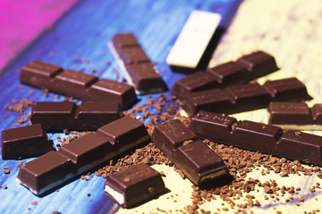 Chocolate bar close up on colorful background