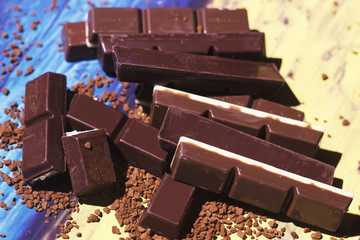Chocolate bar close up on colorful background