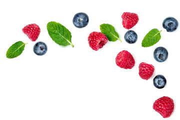 Fresh  raspberries and blueberries with leaves isolated on white background. Berry ornament
