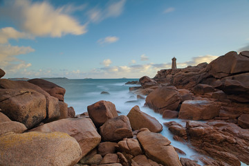 Ploumanach Lighthouse at sunrise in pink granite coast, Perros Guirec, France.