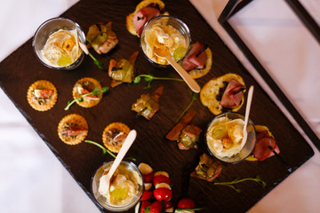 Glasses with seafood snacks, banquet dish