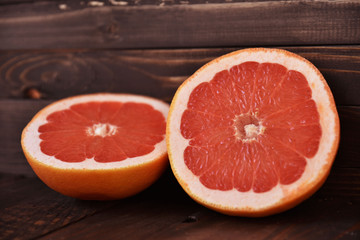 Close-up of juicy grapefruits on a wooden table. Art soft focus.
