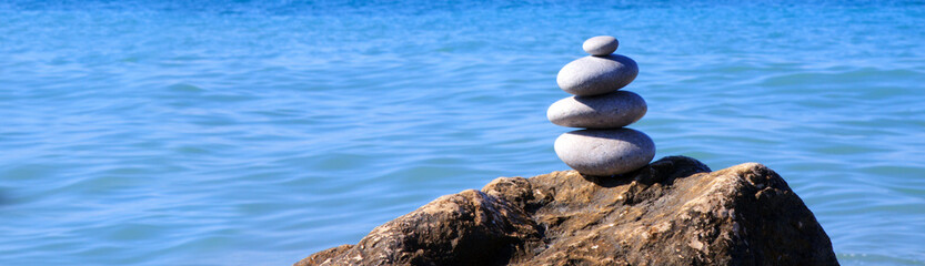 Naklejka na ściany i meble Spa stones balance on beach.