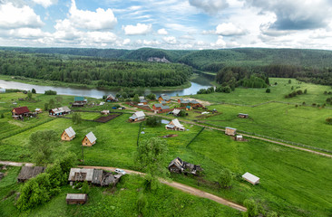Fototapeta na wymiar View from the helicopter to the village near the river