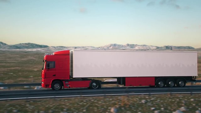 semi trailer truck driving along a desert road into the sunset