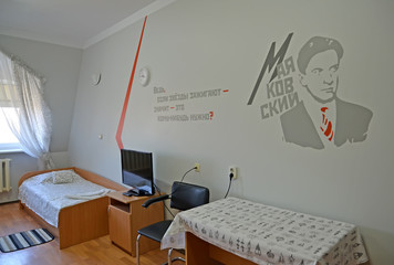 The single hotel room with a portrait of the Russian poet Vladimir Mayakovsky on a wall