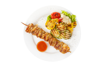 Shish kebab, beef, lamb, pork, chicken grilled meat, barbecue, with side dish vegetables, isolated on white background. Ketchup, tomato, red sauce. View from above For the menu