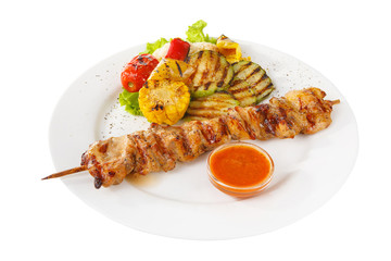 Shish kebab, beef, lamb, pork, chicken grilled meat, barbecue, with side dish vegetables isolated on white background. Ketchup, tomato, red sauce. Side view For the menu