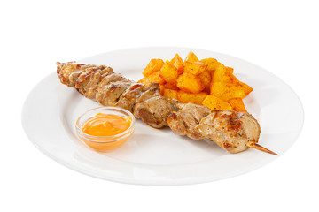 Shish kebab, beef, lamb, pork, chicken grilled meat, barbecue, with side dish potato on a plate, isolated on white background. Mustard, yellow sauce. Side view For the menu