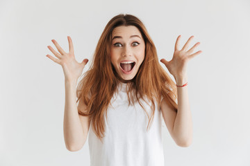 Surprised happy woman in t-shirt looking at the camera