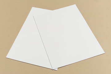 White business card on wooden table. Blank portrait A4.