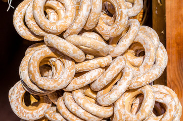 Sweets gingerbreads and bagels round form sprinkled with sugarfood fair on wooden background
