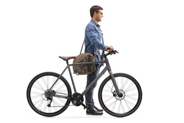 Young man with a bicycle waiting in line