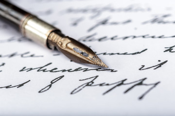 Fototapeta premium Fountain pen on an antique handwritten letter