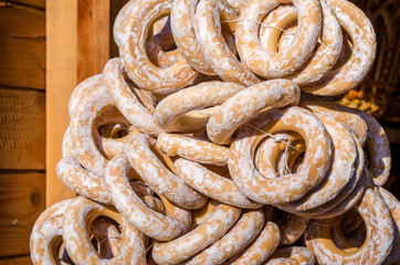 Sweets gingerbreads and bagels round form sprinkled with sugarfood fair on wooden background