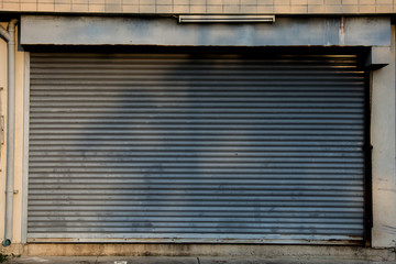 old Steel rolling shutter with  wall.