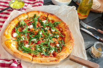 delicious italian pizza served on wooden table top view