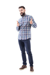 Naklejka premium Confident cool friendly bearded guy pointing finger at camera and biting lips. Full body isolated on white background. 
