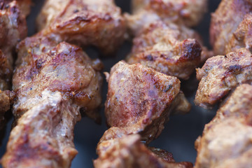Fresh meat shish kebab fried and smoked on a charcoal grill. Roast the meat close up