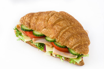 Croissant sandwich with cheese, ham and vegetables Isolated on white background