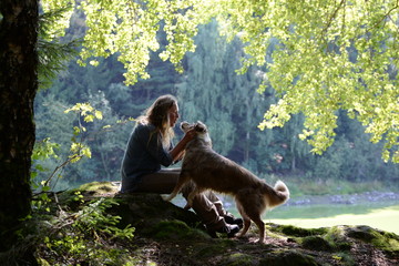 Friends, woman and dog in spring light