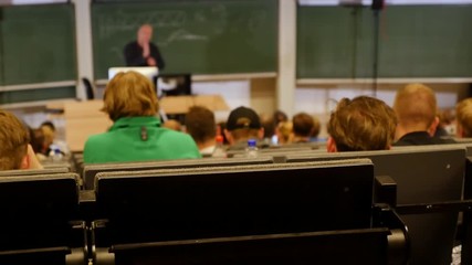 Professor or teacher delivers a lecture college to a large audience of students  - Powered by Adobe
