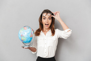 Portrait of an astonished young business woman