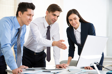 Businessman explains to colleagues a new project