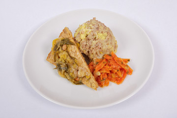 Tempeh with leek and mash on a white
