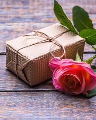 Spring flowers , present box, gift on dark vintage wooden background