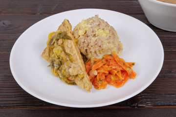 Tempeh with leek and mash on a table