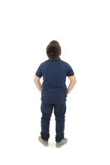 Fototapeta premium Adorable little boy looking above him. Rear view, Isolated on white background 