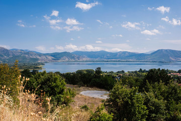 Fototapeta na wymiar Panoramic view from mountain on the Kastoria town and neighborhood Orestias lake. Greece