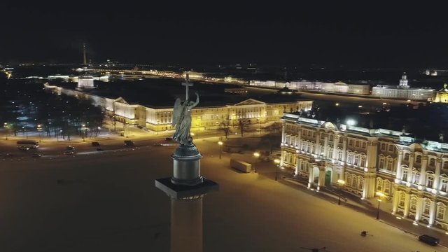 Night view of the square and the angel with a cross in the city of St. Petersburg