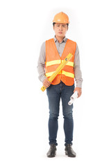 Studio portrait of construction worker in orange waistcoat and hardhat holding levelling tool and building plan