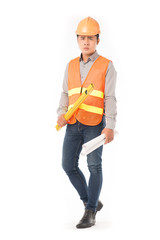 Studio portrait of construction worker in orange waistcoat and hardhat holding levelling tool and...