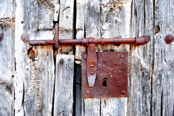 Old wood door with a rusty lock